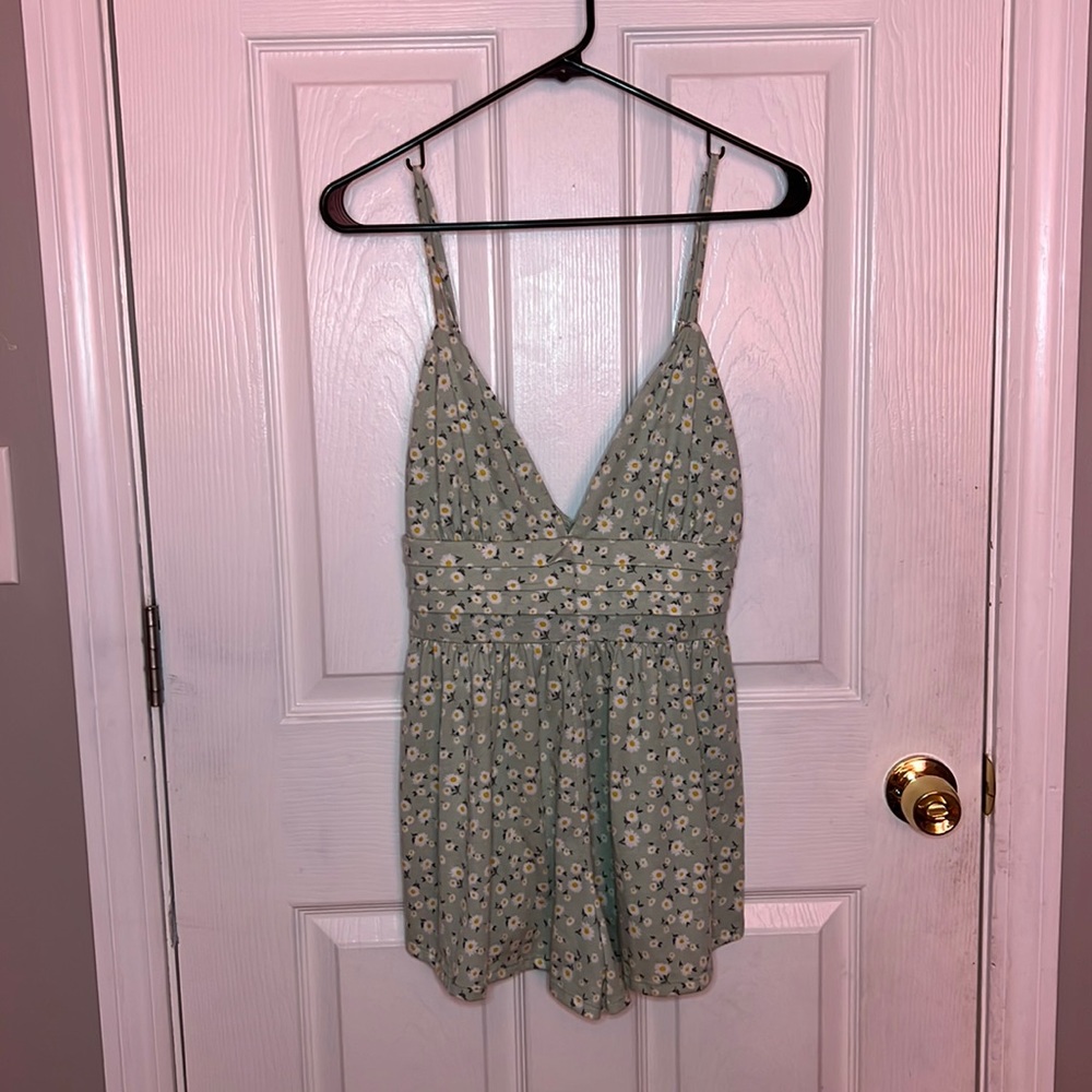 Daisy print romper, size medium, adjustable straps, low cut